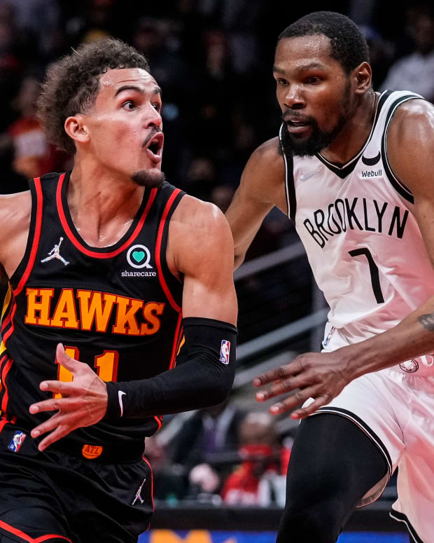 Dec 10, 2021; Atlanta, Georgia, USA; Atlanta Hawks guard Trae Young (11) tries to get to the basket guarded by Brooklyn Nets forward Kevin Durant (7) during the second half at State Farm Arena.
