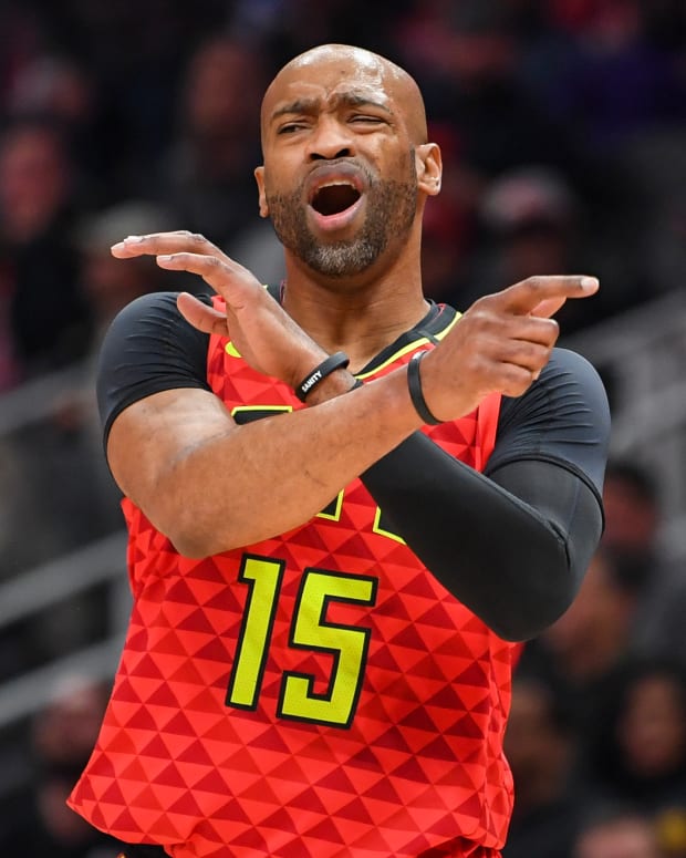Atlanta Hawks guard Vince Carter (15) reacts after a foul call late in the game playing against the Houston Rockets during the second half at State Farm Arena.