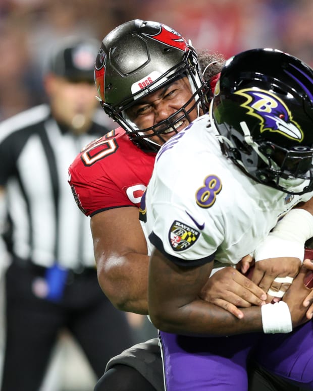 Tampa Bay Buccaneers defensive tackle Vita Vea sacks Baltimore Ravens quarterback Lamar Jackson.