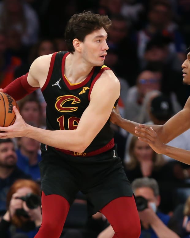 Cleveland Cavaliers forward Cedi Osman (16) and New York Knicks guard Immanuel Quickley (5) during the second half at Madison Square Garden.