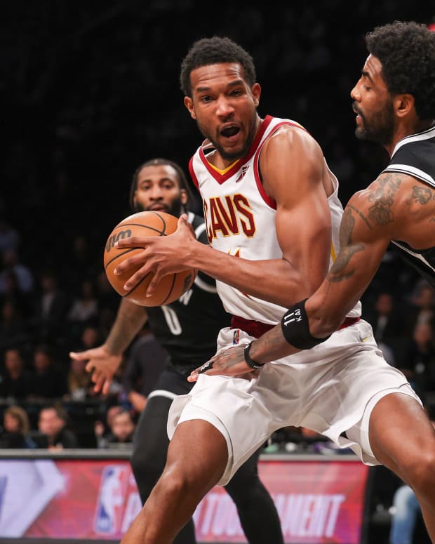 Cleveland Cavaliers center Evan Mobley (4) shields the ball from Brooklyn Nets guard Kyrie Irving (11) during the first quarter at
