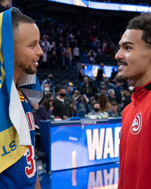 Golden State Warriors guard Stephen Curry (30) and Atlanta Hawks guard Trae Young (11) talk after the game at Chase Center.