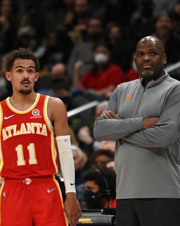 Atlanta Hawks guard Trae Young (11) and head coach Nate McMillan on December 17, 2021. ESPN has already projected the 2022-23 record and rankings.