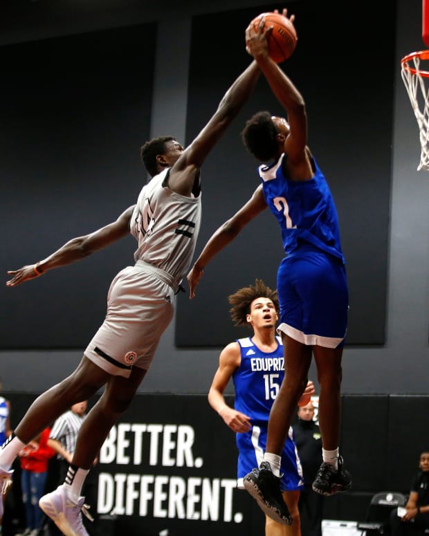 Jan 7, 2021; Phoenix, AZ, USA; Prolific Prep's Yohan Traore (14) attempts to block a dunk from Eduprize Academy's Devontes Cobbs (2) during the first half at the PHHacility basketball gym. Mandatory Credit: Patrick Breen-Arizona Republic Phhacility Basketball Gym
