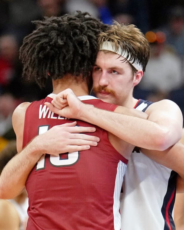 Gonzaga Bulldogs forward Drew Timme (2) hugs Arkansas Razorbacks forward Jaylin Williams (10) after the game in the semifinals of the West regional of the men's college basketball NCAA Tournament at Chase Center. The Arkansas Razorbacks won 74-68.