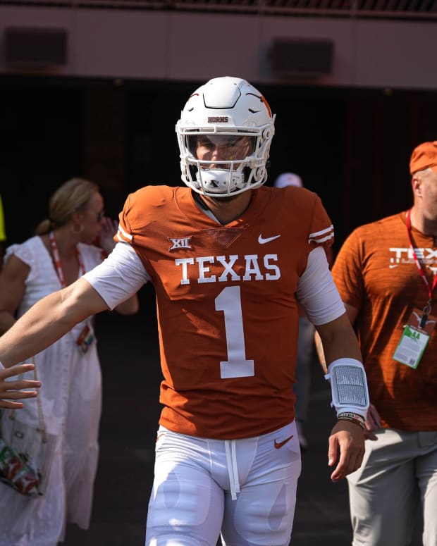 Texas quarterback Hudson Card (1) greets fans while walking onto the field before the game against Alabama at Royal Memorial Stadium on Sep. 10, 2022.