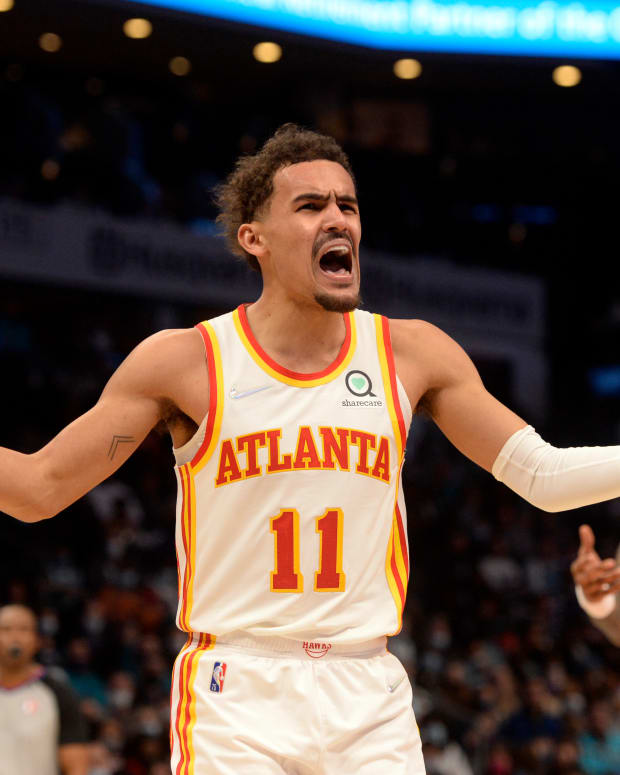 Jan 23, 2022; Charlotte, North Carolina, USA; Atlanta Hawks guard Trae Young (11) reacts after being called on a foul during the second half against the Charlotte Hornets at The Spectrum Center.