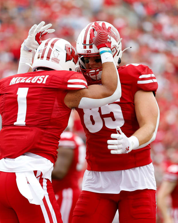 Wisconsin running back Chez Mellusi and tight end Clay Cundiff celebrate after a touchdown against New Mexico State.