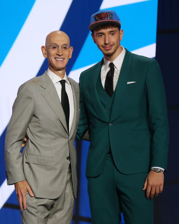 Alperen Sengun (Besiktas, Turkey) poses with NBA commissioner Adam Silver after being selected as the number sixteen overall pick by the Oklahoma City Thunder in the first round of the 2021 NBA Draft at Barclays Center.