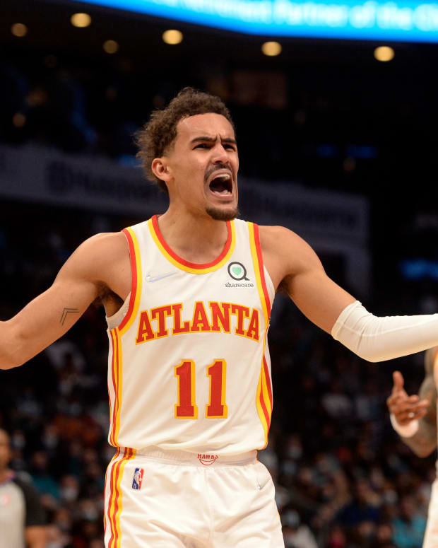 Jan 23, 2022; Charlotte, North Carolina, USA; Atlanta Hawks guard Trae Young (11) reacts after being called on a foul during the second half against the Charlotte Hornets at The Spectrum Center.