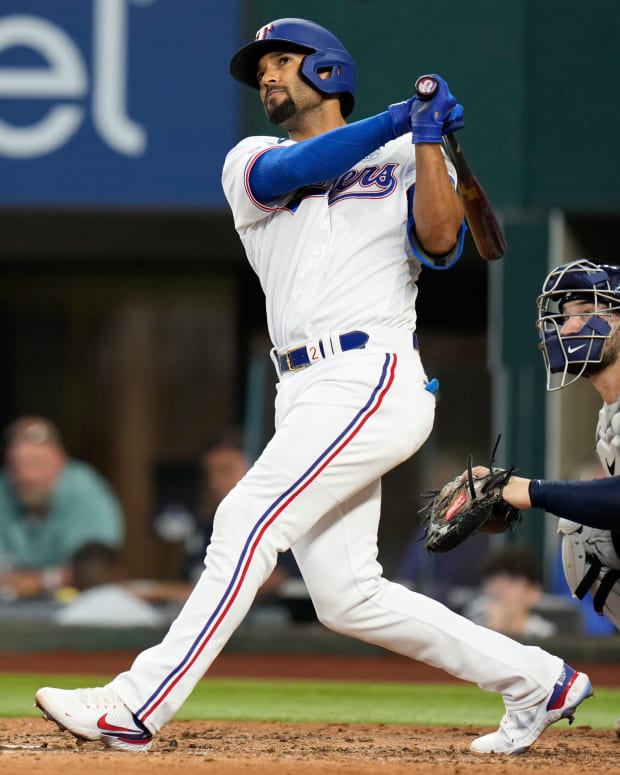 Jun 2, 2022; Arlington, Texas, USA; Texas Rangers shortstop Marcus Semien (2) follows though on his home run against the Tampa Bay Rays during the sixth inning at Globe Life Field. Mandatory Credit: Jim Cowsert-USA TODAY Sports