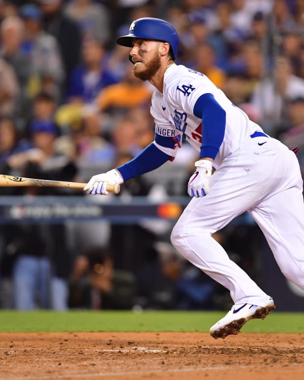 Oct 12, 2022; Los Angeles, California, USA; Los Angeles Dodgers center fielder Cody Bellinger (35) hits a single in the sixth inning of game two of the NLDS for the 2022 MLB Playoffs against the San Diego Padres at Dodger Stadium. Mandatory Credit: Gary A. Vasquez-USA TODAY Sports