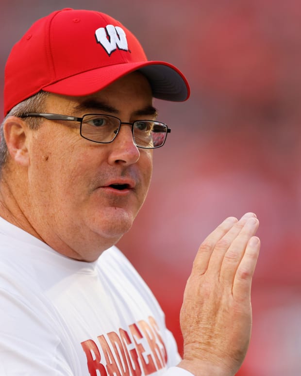Wisconsin head coach Paul Chryst clapping on the sidelines in pregame against Illinois State.