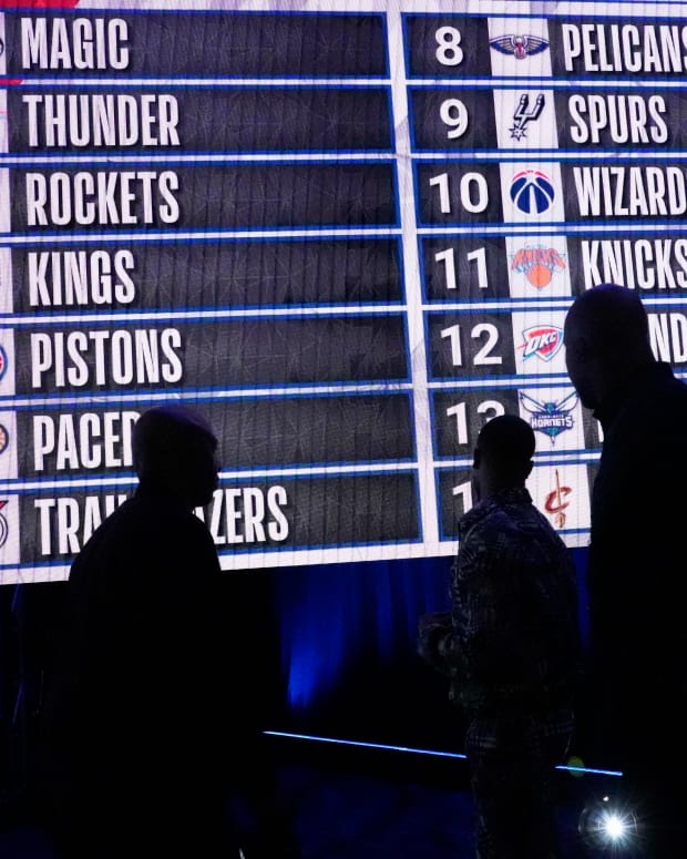 May 17, 2022; Chicago, IL, USA; People look at the draft lottery order after the 2022 NBA Draft Lottery at McCormick Place.