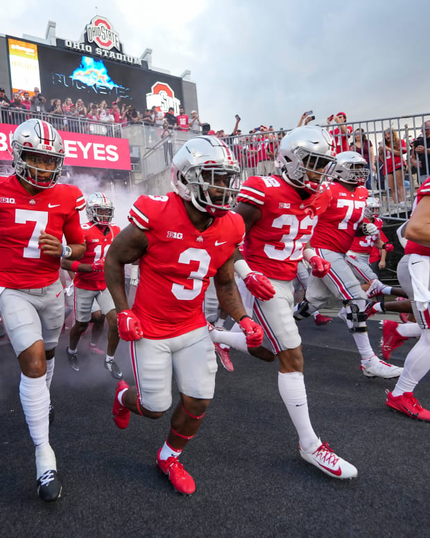 Ohio State players run out of the tunnel ahead of their game versus Toledo