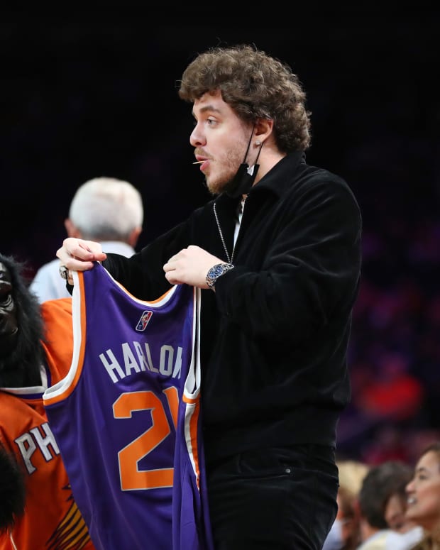 Rapper/recording artist Jack Harlow receives a Phoenix Suns jersey from mascot The Gorilla against the New Orleans Pelicans in the first half at Footprint Center.