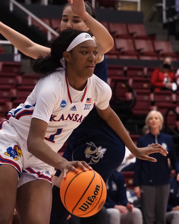 Mar 18, 2022; Stanford, California, USA; Kansas Jayhawks center Taiyanna Jackson (1) controls the ball against Georgia Tech Yellow Jackets center Nerea Hermosa (20) during the first quarter at Maples Pavilion. Mandatory Credit: Kelley L Cox-USA TODAY Sports