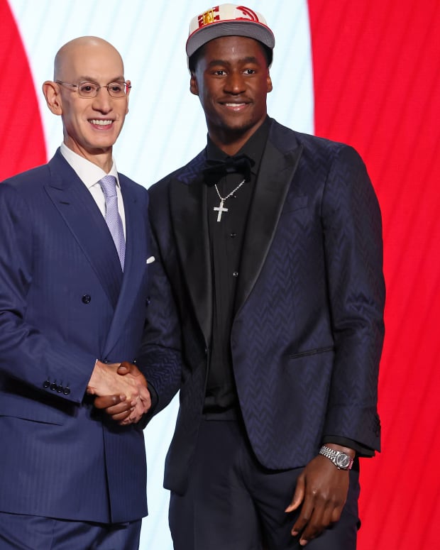A.J. Griffin (Duke) shakes hands with NBA commissioner Adam Silver after being selected as the number sixteen overall pick by the Atlanta Hawks in the first round of the 2022 NBA Draft at Barclays Center.