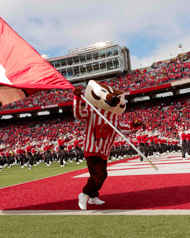Bucky Badger waving the Wisconsin flag.