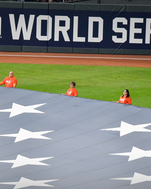 Oct 26, 2021; Houston, Texas, USA; A view of the US flag and the World Series logo during the national anthem before the game between the Houston Astros and the Atlanta Braves game one of the 2021 World Series at Minute Maid Park. Mandatory Credit: Jerome Miron-USA TODAY Sports