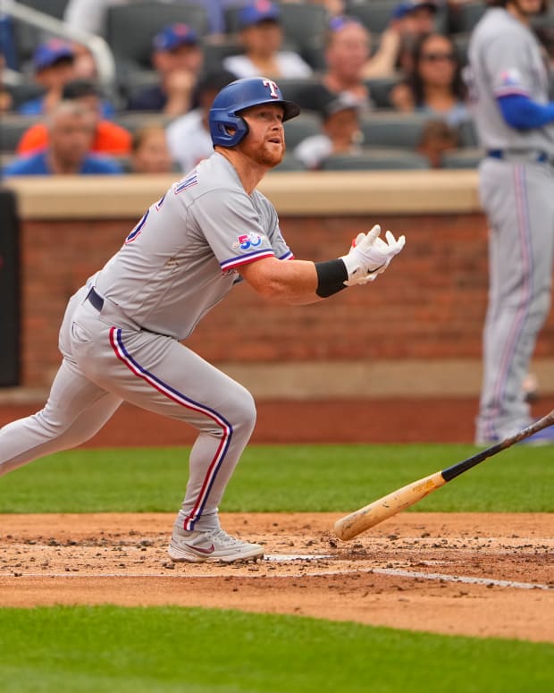 Jul 2, 2022; New York City, New York, USA; Texas Rangers right fielder Kole Calhoun (56) watches his three-run home run against the New York Mets during the second inning at Citi Field. Mandatory Credit: Gregory Fisher-USA TODAY Sports