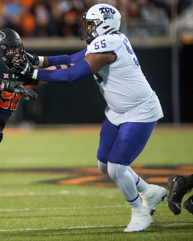Nov 13, 2021; Stillwater, Oklahoma, USA; TCU Horned Frogs offensive tackle Obinna Eze (55) blocks Oklahoma State Cowboys defensive tackle Brendon Evers (98) during the second quarter at Boone Pickens Stadium.