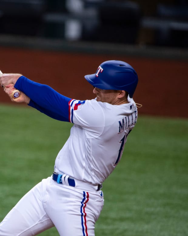 Jun 22, 2022; Arlington, Texas, USA; Texas Rangers designated hitter Brad Miller (13) hits a single and drives in two runs against the Philadelphia Phillies during the second inning at Globe Life Field. Mandatory Credit: Jerome Miron-USA TODAY Sports