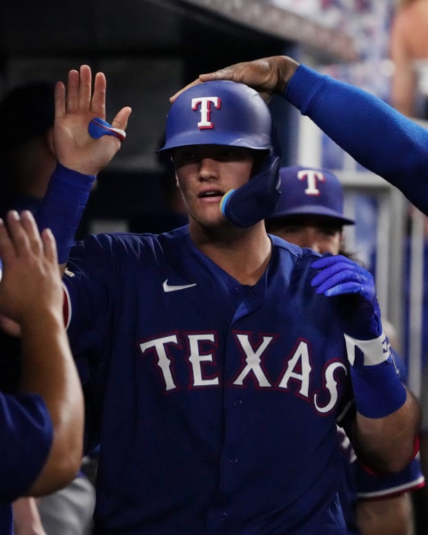 Sep 12, 2022; Miami, Florida, USA; Texas Rangers third baseman Josh Jung (6) celebrates in the dugout after hitting a solo home run in the fifth inning against the Miami Marlins at loanDepot park. Mandatory Credit: Jasen Vinlove-USA TODAY Sports