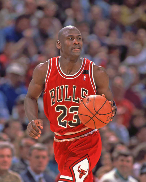 Chicago Bulls guard (23) Michael Jordan dribbling the ball during the game against Orlando Magic at the Orlando Arena