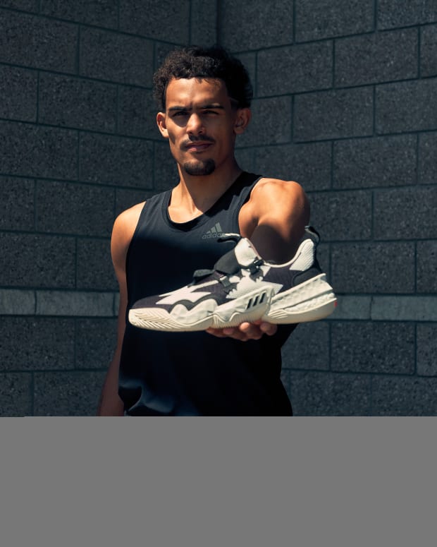 Trae Young wears his signature adidas basketball shoe in the 'SO SO DEF' colorway.