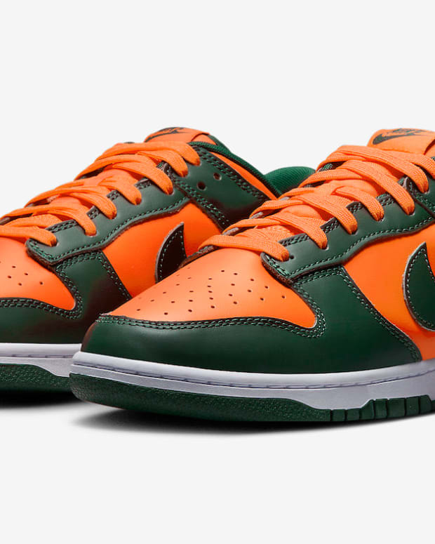 Green and orange Nike Dunk shoes.