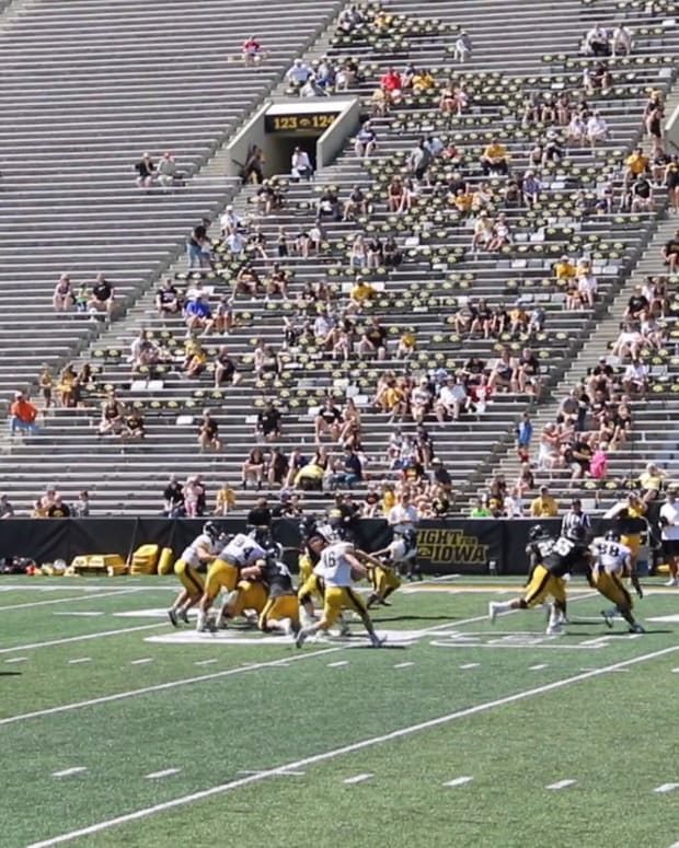 The Iowa football team scrimmages during the 'Kids at Kinnick' event last year.