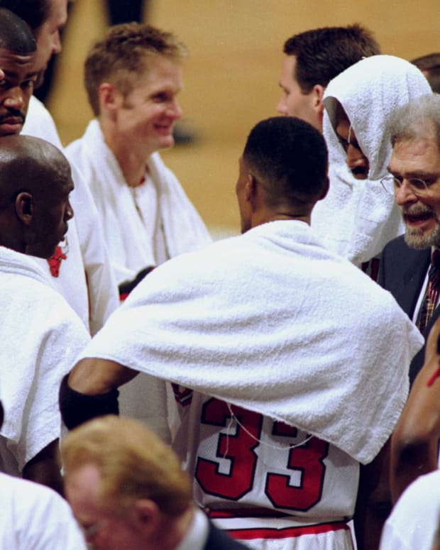 April 8, 1998; Chicago Bulls coach Phil Jackson with Scott Burrell Scottie Pippen, Michael Jordan, Toni Kukoc, Dickey Simpkins, Steve Kerr and Dennis Rodman