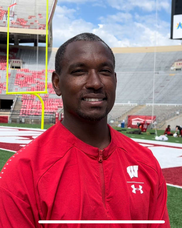 Wisconsin assistant coach Bobby Engram speaking with reporters during fall camp (Credit: Matt Belz, All Badgers)