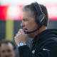 Eagles defensive coordinator Jim Schwartz speaks with the coaching staff Sunday at Lincoln Financial Field.