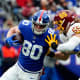 New York Giants tight end Kyle Rudolph (80) runs with the ball with pressure from Washington Football Team linebacker Cole Holcomb (55) in the first half at MetLife Stadium on Sunday, Jan. 9, 2022.