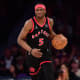 Toronto Raptors forward Precious Achiuwa (5) brings the ball up court against the Los Angeles Lakers during the first half at Crypto.com Arena.