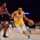 Los Angeles Lakers guard Talen Horton-Tucker (5) moves the ball against Toronto Raptors guard Armoni Brooks (1) during the second half at Crypto.com Arena.