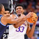 Apr 2, 2022; New Orleans, LA, USA; Kansas Jayhawks forward David McCormack (33) controls the ball while defended by Villanova Wildcats forward Eric Dixon (43) during the second half during the 2022 NCAA men's basketball tournament Final Four semifinals at Caesars Superdome. Bob Donnan-USA TODAY Sports