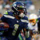 Seattle Seahawks wide receiver D'Wayne Eskridge (1) runs the ball against the Los Angeles Chargers during the first quarter at Lumen Field.