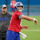 New York Giants quarterback Daniel Jones (8) throws the ball as head coach Joe Judge looks on during OTA practice at the Quest Diagnostics Training Center on Friday, June 4, 2021, in East Rutherford.