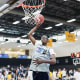Christian Koloko, the Toronto Raptors' No. 33 pick in the 2022 NBA Draft, dunks a basketball at the 2018 Basketball Without Borders camp in Los Angeles