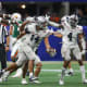 Dec 16, 2023; Atlanta, GA, USA; Howard Bison defensive lineman Ian White (14) reacts after an interception against the Florida A&amp;M Rattlers in the first half at Mercedes-Benz Stadium.