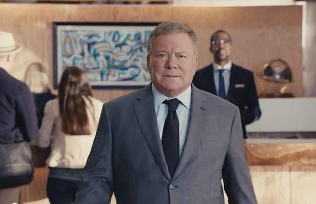 blue dress in priceline commercial William Shatner Returns as Priceline's Negotiator in New Ad (Video)