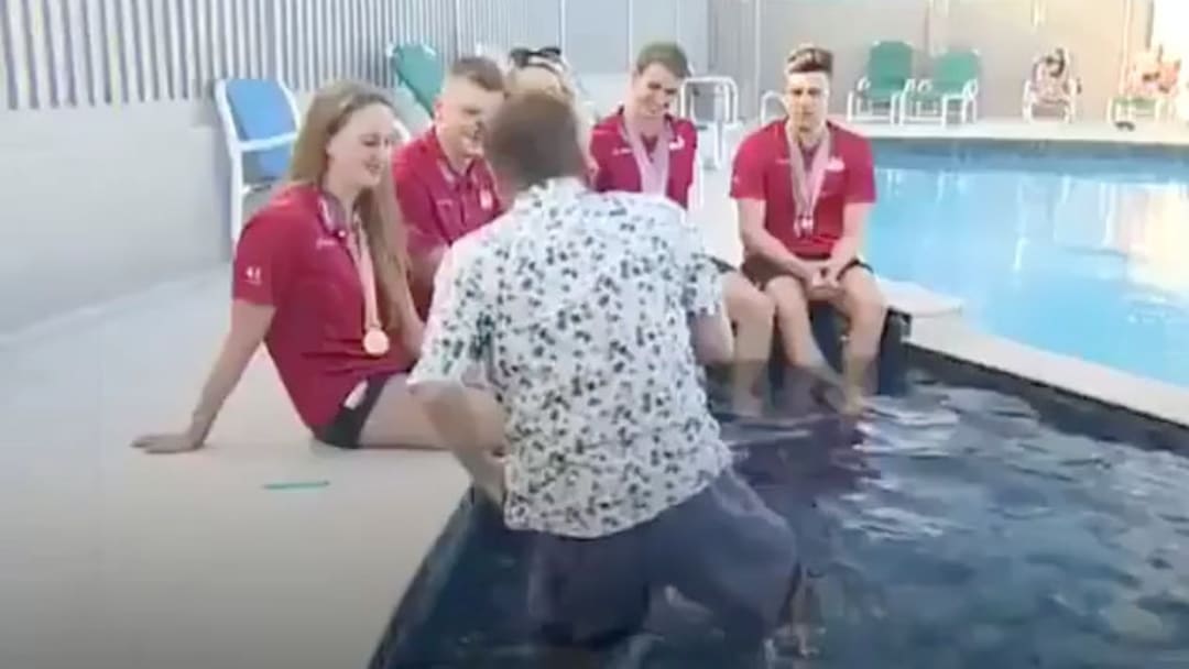 Reporter Falls Into a Pool During Live Interview With British Swim Team