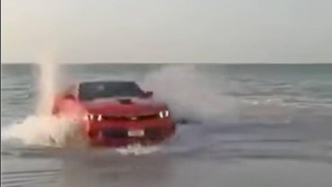 Watch: Idiot Chevy Camaro driver does donuts in the ocean