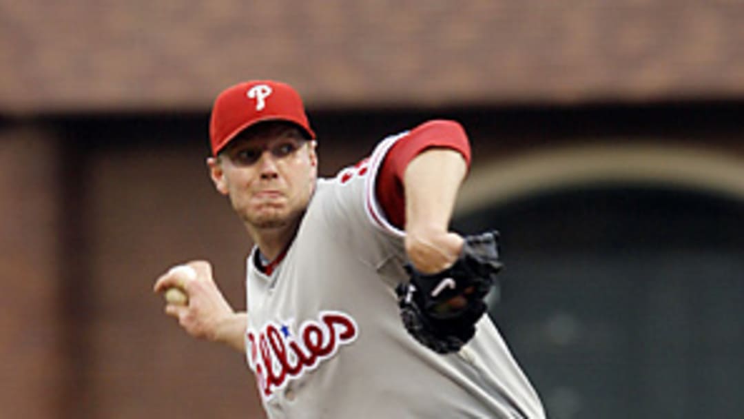 Fighting a groin pull, Halladay guts out critical Game 5 win for Phillies