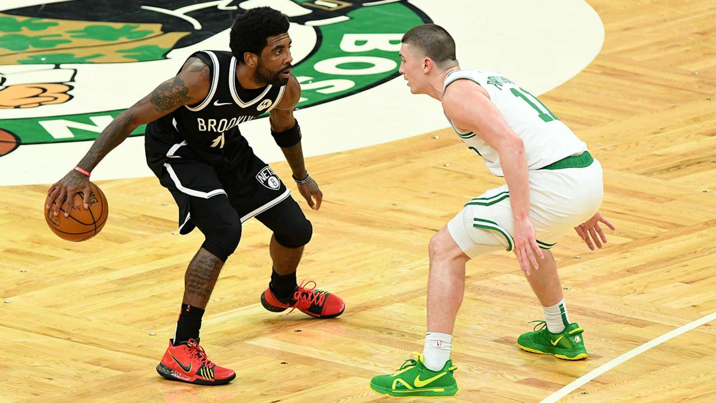 kyrie stomps on logo