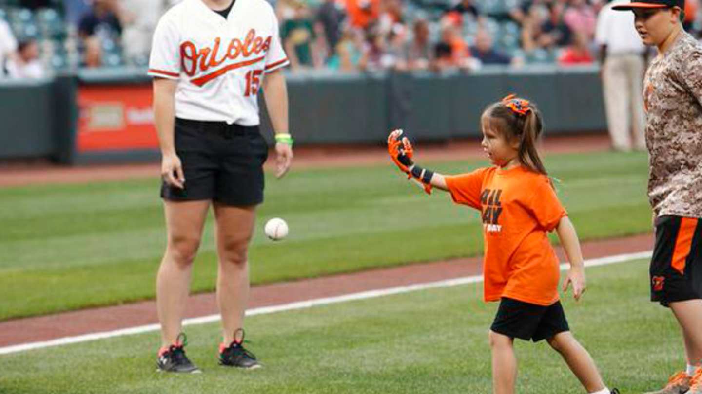Baltimore Orioles fan throws first pitch with prosthetic hand Sports
