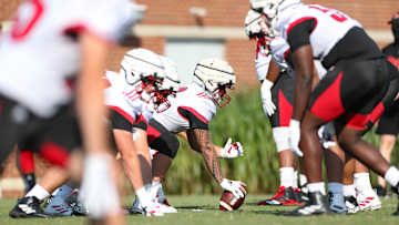 Louisville offensive line learning from mental mistakes